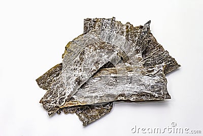 Dry laminaria japonicaï¼ˆkelpï¼‰Isolated on white background. Kombu seaweed, traditional Japanese ingredient for cooking Dashi Stock Photo